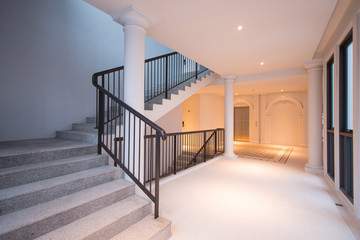 Stone staircase with black iron handrails
