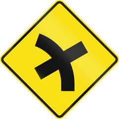 Australian road warning sign - 4 way intersection in curve ahead