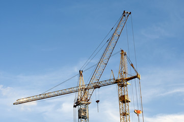 construction cranes against the sky