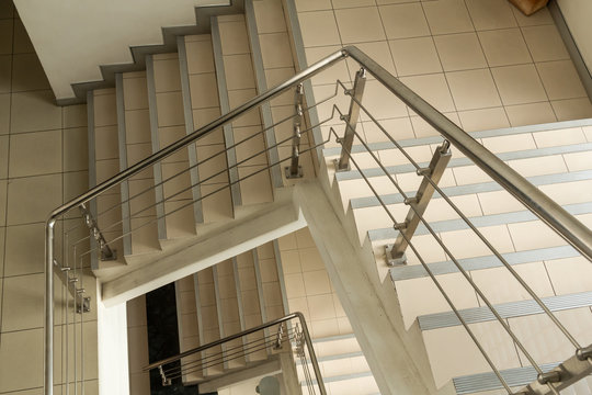 Modern stairs with stainless steel handrail