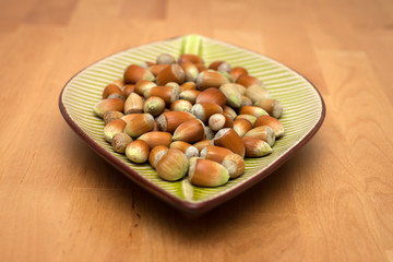 Fresh hazelnuts in a plate
