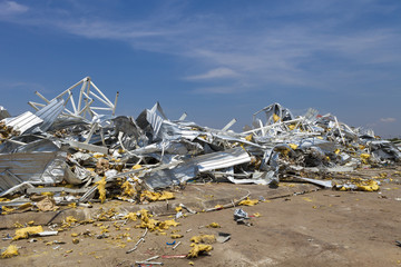 collapsed steel structure and metal sheet roof salvage