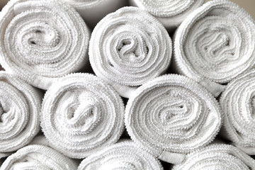rolled white body towels, beautiful background