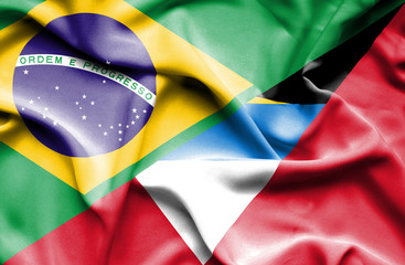 Waving flag of Antigua and Barbuda and Brazil