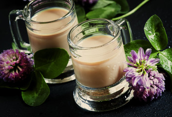 Irish liqueur and clover, selective focus