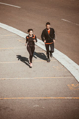 Couple running in an urban environment. Bird`s eye view