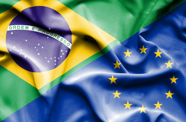 Waving flag of European Union and Brazil