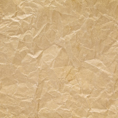 close up shot of light brown crumpled recycled paper texture background
