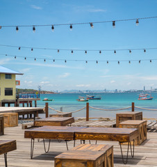 Wooden table at outdoor restaurant.Background is landscape of sea