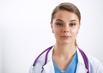 Woman doctor standing with stethoscope at hospital