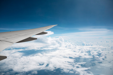 wing transport aircraft above the clouds