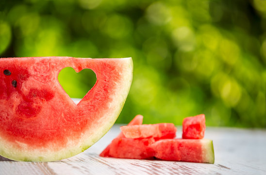 Watermelon slice with heart shape hole