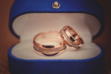 wedding rings in a blue box