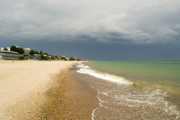 Empty beach and overcast sky