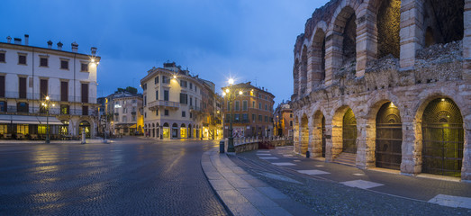 Obraz na płótnie Canvas street and Arena di Verona in morning twilight in Italy
