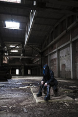 Gothic girl in the image of an abandoned factory