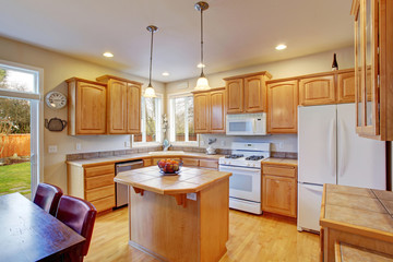 Modern kitchen with hardwood floor.