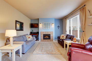 Nice living room with blue walls and carpet.