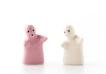 Salt and Pepper Shaker in hug on White