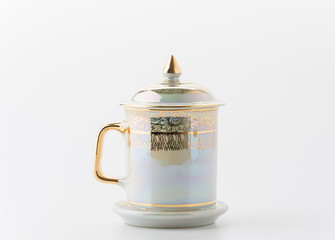 a cup of coffee with golden thai texture