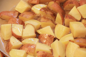French fries cooking in boiling oil