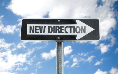 New Direction direction sign with sky background