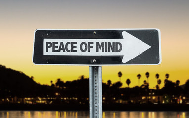 Peace of Mind direction sign with sunset background