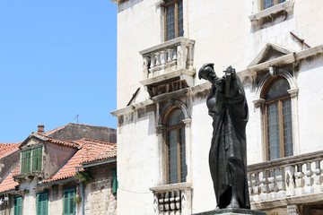 Sculpture of historic Croatian writer and poet Marko Marulic on Square of the Radic brothers (Fruit square) in Split Croatia.