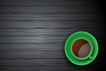 Green Cup of coffee or tea on the table dark wood