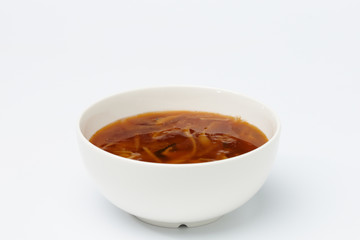 Vegetarian soup in white cup.