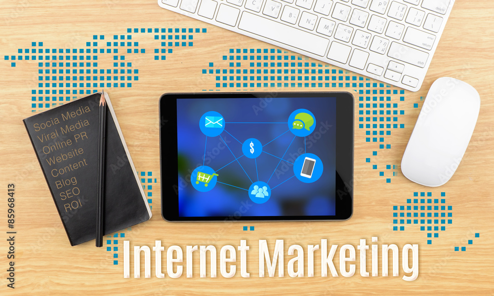 Poster internet marketing word with tablet,keyboard and black notebook