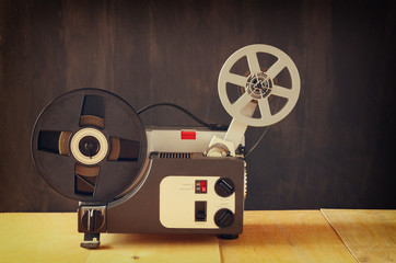 old 8mm Film Projector over wooden table