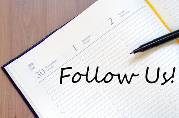 Follow us concept Notepad