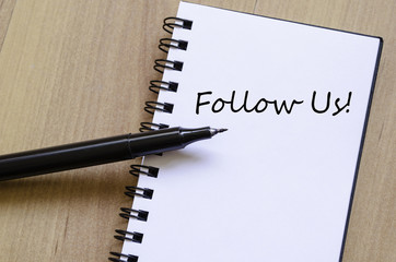 Follow us concept Notepad