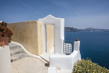 View at the sea through a white door and arch in Oia, Santorini, Greece - Europe