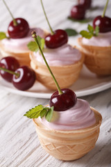 sweet tartlet with cream and cherry close up. vertical
