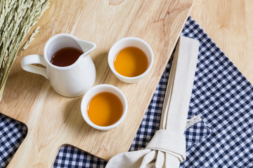 Wood Texture Cutting Plate with Cups of Tea
