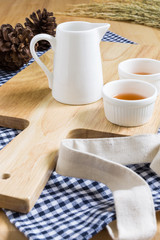 Wood Texture Cutting Plate with Cups of Tea