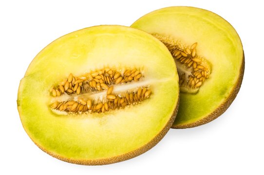 Halves of yellow melon isolated on white background