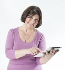 Elderly woman with tablet computer..