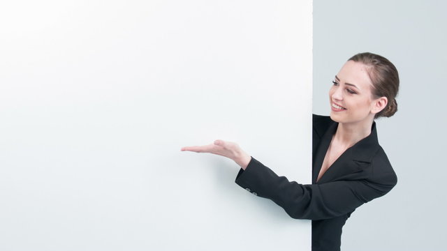  Woman peeking out and showing on white board
