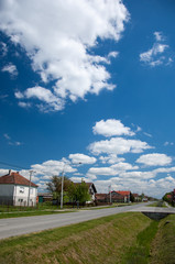 Obraz premium Main road of a small slavonian village on a sunny day