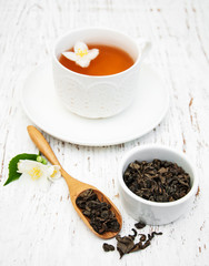 Cup of tea with jasmine flowers