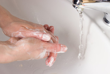 woman washing her hands