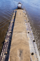 river barge loaded with sand