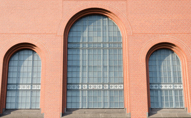 Glass arched window in a red brick building