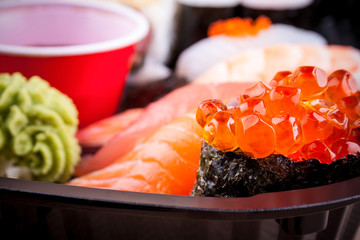 Salmon caviar ikura sushi with selective focus