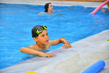 Boy age 8 at the swimming pool