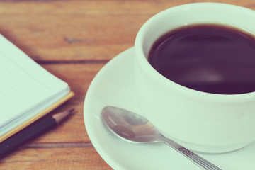 cup of coffee on a wooden table
