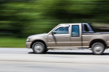 Fototapeta na wymiar pick-up Speeding in road